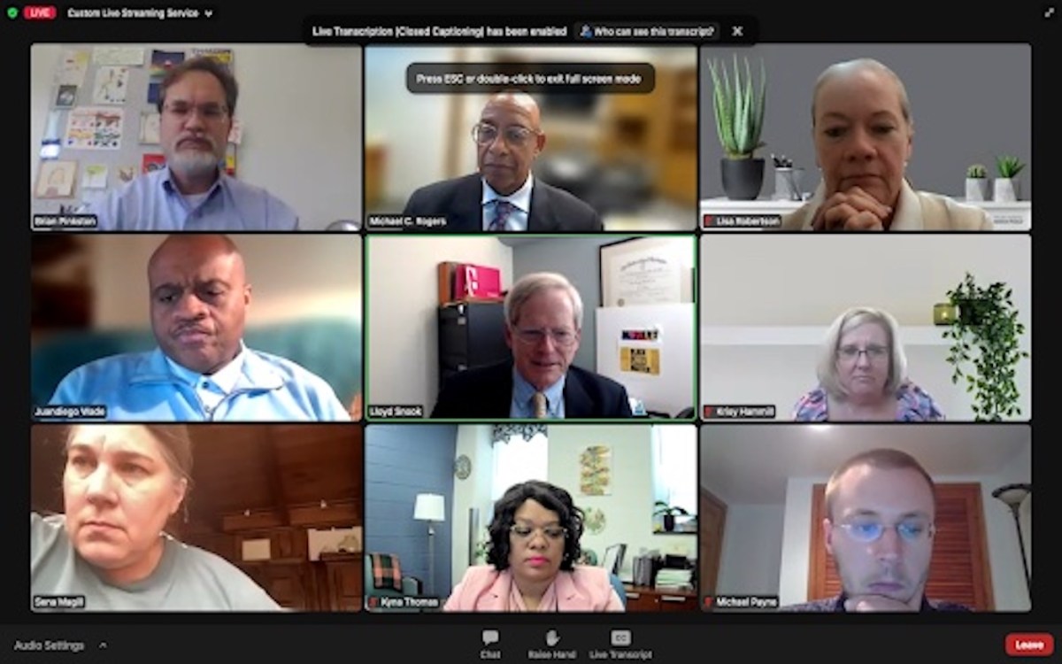Nine people appear on a Zoom conference call.