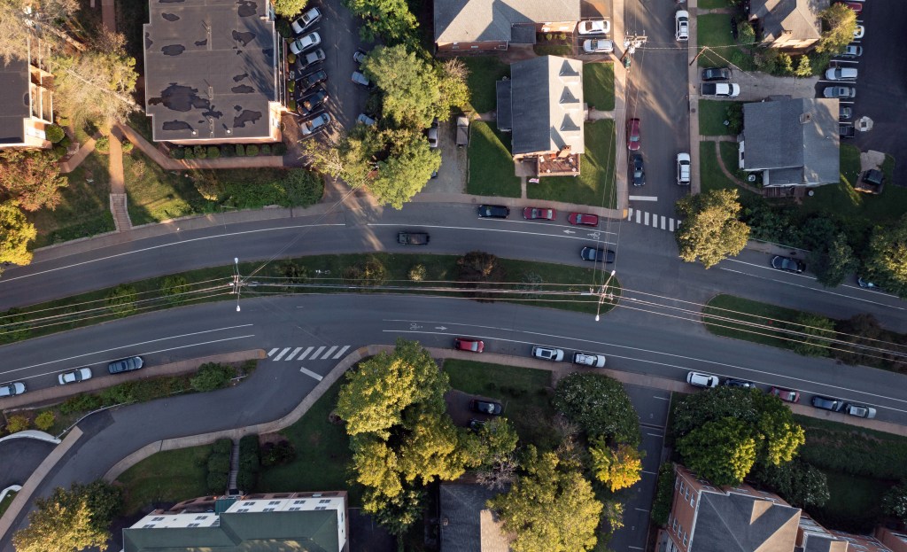 Aerial view of boulevard with rooftops
