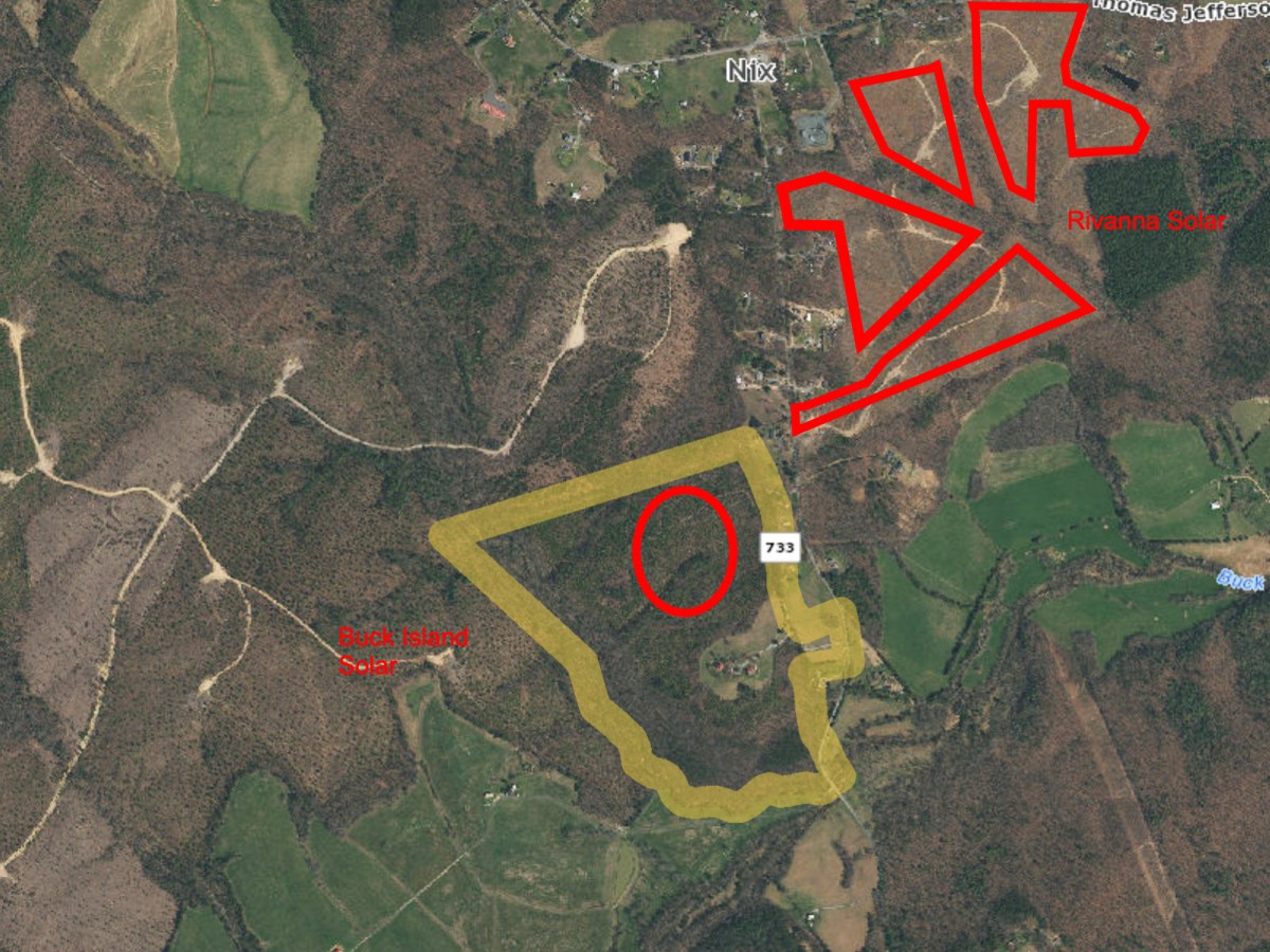 A satellite image of a mostly wooded area shows different locations marked off in red and yellow.
